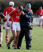 18 March 2007; Cork's Nial McCarthy is helped off the field after sustaining an eye injury. Down v Cork, Allianz National Hurling League, Division 1A, Round 3, Ballygalget, Co. Down. Picture credit: Oliver McVeigh / SPORTSFILE
