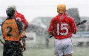 18 March 2007; Down's Liam Clarke and Cork's Joe Deane during a hail and snow storm. Down v Cork, Allianz National Hurling League, Division 1A, Round 3, Ballygalget, Co. Down. Picture credit: Oliver McVeigh / SPORTSFILE