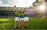 21 September 2014; Kerry players from left, Peter Crowley, Fionn Fitzgerald and Shane Enright celebrate at the end of the game. GAA Football All Ireland Senior Championship Final, Kerry v Donegal. Croke Park, Dublin. Picture credit: David Maher / SPORTSFILE