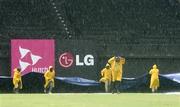 23 March 2007; Sabina Park ground staff cover the pitch during a rain break. ICC Cricket World Cup, Group D, Ireland v West Indies, Sabina Park, Kingston, Jamaica. Picture credit: Pat Murphy / SPORTSFILE