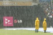23 March 2007; Members of the Sabina Park ground staff wait for the rain to stop. ICC Cricket World Cup, Group D, Ireland v West Indies, Sabina Park, Kingston, Jamaica. Picture credit: Pat Murphy / SPORTSFILE