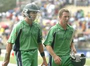 23 March 2007; Ireland's Kyle McCallan, left, and Andrew White leave the pitch as the match is stoped due to rain. ICC Cricket World Cup, Group D, Ireland v West Indies, Sabina Park, Kingston, Jamaica. Picture credit: Pat Murphy / SPORTSFILE