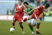 24 March 2007; Stephen Hunt, Republic of Ireland, is tackled by Samuel Ricketts, right, and Simon Davies, left, Wales. 2008 European Championship Qualifier, Republic of Ireland v Wales, Croke Park, Dublin. Picture credit: Matt Browne / SPORTSFILE