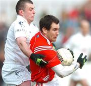 25 March 2007; Peter McGinnity, Louth, in action against Padraig O'Neill, Kildare. Allianz National Football League, Division 1B, Round 5, Kildare v Louth, Newbridge, Co. Kildare. Picture credit: David Maher / SPORTSFILE
