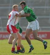 25 March 2007; John Galvin, Limerick, in action against Kelvin Hughes, Tyrone. Allianz National Football League, Division 1A, Round 5, Limerick v Tyrone, Gaelic Grounds, Limerick. Picture credit: Kieran Clancy / SPORTSFILE