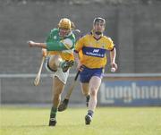 25 March 2007; Ger Oakley, Offaly, boots the sliothar up field from Clare's Niall Gilligan. Allianz National Hurling League, Division 1A, Round 4, Offaly v Clare, Birr, Co. Offaly. Picture credit: Ray McManus / SPORTSFILE