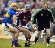 25 March 2007; Richie Murray, Galway, in action against Eamonn Corcoran, Tipperary, as linesman Dickie Murphy looks on. Allianz National Hurling League, Division 1B, Round 4, Galway v Tipperary, Pearse Stadium, Galway. Picture credit: Ray Ryan / SPORTSFILE