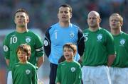 24 March 2007; Republic of Ireland players, from left, captain Robbie Keane, Shay Given, Lee Carsley, and Damien Duff, stand with mascots for the National Anthem. 2008 European Championship Qualifier, Republic of Ireland v Wales, Croke Park, Dublin. Picture credit: Brian Lawless / SPORTSFILE