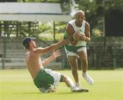 28 March 2007; Ireland's Andre Botha is tackled by John mooney during team training. The Bourda Grounds, Georgetown, Guyana. Picture credit: Pat Murphy / SPORTSFILE