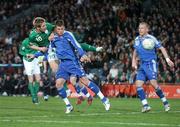 28 March 2007; Kevin Doyle, Republic of Ireland, shoots to score his side's first goal despite the attentons of Slovakia's Martin Skrtel. 2008 European Championship Qualifier, Republic of Ireland v Slovakia, Croke Park, Dublin. Picture credit: Brian Lawless / SPORTSFILE