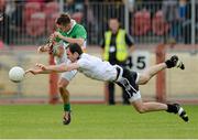 28 September 2014; Mark Donnelly, Carrickmore Naomh Colmcille,  has his shot blocked down by Justin McMahon, Omagh St. Enda’s. Tyrone County Senior Football Championship Final, Carrickmore Naomh Colmcille v Omagh St. Enda’s, Healy Park, Omagh, Co. Tyrone. Picture credit: Oliver McVeigh / SPORTSFILE