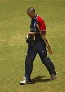 30 March 2007; Kevin Pietersen, England, leaves the field after being caught out by William Porterfield, Ireland. ICC Cricket World Cup 2007, Super 8, Ireland v England, Guyana National Stadium, Georgetown, Guyana. Picture credit: Pat Murphy / SPORTSFILE