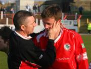 31 March 2007; A dejected Mark Holland, Cliftonville, is comforted by manager Eddie Patterson after the game. JJB Sports Irish Cup Semi-Final, Cliftonville v Dungannon Swifts, The Oval, Belfast, Co. Antrim. Picture credit: Russell Pritchard / SPORTSFILE