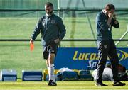 10 October 2014; Republic of Ireland assistant manager Roy Keane walks past manager Martin O'Neill during squad training ahead of their UEFA EURO 2016 Championship Qualifer, Group D, game against Gibraltar on Saturday. Republic of Ireland Squad Training, Gannon Park, Malahide, Co. Dublin. Picture credit: David Maher / SPORTSFILE