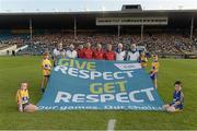 13 September 2014; Referee Cathal McAllister with his umpires, officials and the GAA 'Give Respect Get Respect' banner. Bord Gáis Energy GAA Hurling Under 21 All-Ireland 'A' Championship Final, Clare v Wexford. Semple Stadium, Thurles, Co. Tipperary. Picture credit: Ray McManus / SPORTSFILE