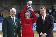 31 March 2007; Old Alexander II captain Fiona Murray is presented with the trophy by Dixon Rose, President of the Irish Hockey Union and John Power, ESB, Head of Corporate Affairs. ESB Women's Irish Junior Cup Final, Bray v Old Alexander II, Belfield, University College Dublin (UCD), Dublin. Picture credit: Ray McManus / SPORTSFILE