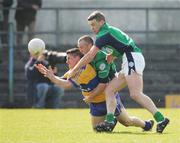 1 April 2007; Gordon Kelly, Clare, in action against Shaun Campbell and Declan Meehan, London. Allianz National Football League, Division 2A Round 5, Clare v London, Cusack Park, Ennis, Co. Clare. Picture credit: Kieran Clancy / SPORTSFILE