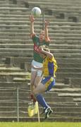 7 April 2007; Tom Cunniffe, Mayo, out jumps Roscommon's David Keenan to win possession. Cadbury's U21 Connacht Football Championship Final, Mayo v Roscommon, McHale Park, Castlebar, Co. Mayo. Picture credit: Pat Murphy / SPORTSFILE