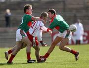 8 April 2007; Kevin Hughes, Tyrone, in action against Andy Moran and Pat Harte, Mayo. Allianz National Football League, Division 1A, Round 7, Tyrone v Mayo, Healy Park, Omagh, Co. Tyrone. Picture credit: Oliver McVeigh / SPORTSFILE
