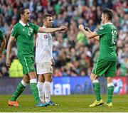 11 October 2014; Robbie Keane, Republic of Ireland, places the captain's armband on team-mate John O'Shea before been substituted. UEFA EURO 2016 Championship Qualifer, Group D, Republic of Ireland v Gibraltar. Aviva Stadium, Lansdowne Road, Dublin. Picture credit: David Maher / SPORTSFILE