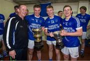 12 October 2014; Cratloe manager Colm Collins with his sons, from left to right, Sean Collins, David Collins and Padraic Collins, celebrate with the cups after victory over Eire Og. Clare County Senior Football Championship Final, Cratloe v Eire Og. Cusack Park, Ennis, Co. Clare. Picture credit: Diarmuid Greene / SPORTSFILE