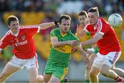 12 October 2014; Eoghan Byrne, Rhode, in action against Colm Byrne, left, and David Hanlon, Edenderry. Offaly County Senior Football Championship Final, Edenderry v Rhode, O'Connor Park, Tullamore, Co. Offaly. Photo by Sportsfile