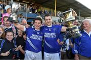 12 October 2014; Cratloe Double County Champions captains, Liam Markham, hurling, left, and football captain Michael Hawes celebrate with their cups. Clare County Senior Football Championship Final, Cratloe v Eire Og. Cusack Park, Ennis, Co. Clare. Picture credit: Diarmuid Greene / SPORTSFILE