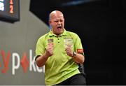 12 October 2014; Michael van Gerwen reacts after winning the fourth leg of the second set during his match with James Wade. partypoker.com World Grand Prix Final, Citywest Hotel, Saggart, Co. Dublin. Picture credit: Barry Cregg / SPORTSFILE