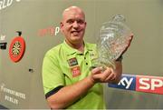 12 October 2014; Michael van Gerwen lifts the trophy after winning the Grand Prix. partypoker.com World Grand Prix Final, Citywest Hotel, Saggart, Co. Dublin. Picture credit: Barry Cregg / SPORTSFILE