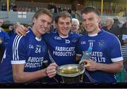 12 October 2014; Cratloe players, and brothers, from left to right, David Collins, Padraic Collins, and Sean Collins celebrate with the cups after victory over Eire Og. Clare County Senior Football Championship Final, Cratloe v Eire Og. Cusack Park, Ennis, Co. Clare. Picture credit: Diarmuid Greene / SPORTSFILE