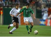 5 June 2002; Ian Harte, Republic of Ireland, is tackled by Miroslav Klose, Germany. FIFA World Cup Finals, Group E, Republic of Ireland v Germany, Ibaraki Stadium, Ibaraki, Japan. Picture credit: David Maher / SPORTSFILE