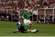 5 June 2002; Damien Duff, Republic of Ireland, is tackled by Germany goalkeeper Oliver Kahn. FIFA World Cup Finals, Group E, Republic of Ireland v Germany, Ibaraki Stadium, Ibaraki, Japan. Picture credit: David Maher / SPORTSFILE