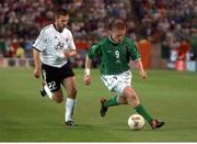 5 June 2002; Damien Duff, Republic of Ireland, races clear of Torsten Frings, Germany. FIFA World Cup Finals, Group E, Republic of Ireland v Germany, Ibaraki Stadium, Ibaraki, Japan. Picture credit: David Maher / SPORTSFILE