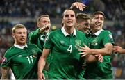 14 October 2014; Republic of Ireland's John O'Shea, centre, celebrates with team-mates, from left to right, James McClean, Aiden McGeady, Jeff Hendrick and Stephen Ward, after scoring his side's equalising goal in injury time. UEFA EURO 2016 Championship Qualifer, Group D, Germany v Republic of Ireland, Veltins Stadium, Gelsenkirchen, Germany. Picture credit: David Maher / SPORTSFILE