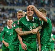 14 October 2014; Republic of Ireland's John O'Shea, centre, celebrates with team-mates James McClean, left, and Jeff Hendrick after scoring his side's equalising goal in injury time. UEFA EURO 2016 Championship Qualifer, Group D, Germany v Republic of Ireland, Veltins Stadium, Gelsenkirchen, Germany. Picture credit: David Maher / SPORTSFILE