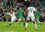 14 October 2014; Republic of Ireland's John O'Shea shoots to score his side's equalising goal despite the attempts of Germany's Mats Hummels. UEFA EURO 2016 Championship Qualifer, Group D, Germany v Republic of Ireland, Veltins Stadium, Gelsenkirchen, Germany. Picture credit: David Maher / SPORTSFILE