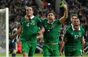 14 October 2014; Republic of Ireland's John O'Shea, 4, celebrates after scoring his side's equalising goal with team-mates Stephen Ward, centre, and Jonathan Walters. UEFA EURO 2016 Championship Qualifer, Group D, Germany v Republic of Ireland, Veltins Stadium, Gelsenkirchen, Germany. Picture credit: David Maher / SPORTSFILE