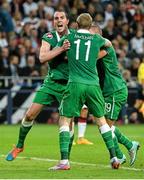 14 October 2014; John O'Shea, Republic of Ireland, celebrates after scoring his side's equalizing goal with team-mate's James McClean and Jonathan Walters. UEFA EURO 2016 Championship Qualifer, Group D, Germany v Republic of Ireland, Veltins Stadium, Gelsenkirchen, Germany. Picture credit: David Maher / SPORTSFILE