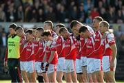 12 October 2014; The Eire Og team stand together during the playing of the National Anthem. Clare County Senior Football Championship Final, Cratloe v Eire Og. Cusack Park, Ennis, Co. Clare. Picture credit: Diarmuid Greene / SPORTSFILE