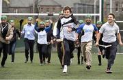 17 October 2014; Clare Hurler Shane O Donnell showcasing his hurling skills to delegates  from the One Young World Summit at Na Fianna GAA club, Glasnevin, Dublin. Picture credit: David Maher / SPORTSFILE