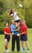10 April 2007; Leinster and Ireland winger Denis Hickie along with Sean O'Connell, left, and Ian Darcy of the Beauties and the Beasts Tag Rugby Team hold model Roberta Rowat aloft while she cathes a bottle of Volvic water at the launch of the Volvic Tag Rugby Summer Leagues. Herbert Park, Ballsbridge, Dublin. Photo by Sportsfile