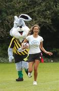 10 April 2007; Model Roberta Rowat is chased by the Irish Tag Rugby Association bunny at the launch of the Volvic Tag Rugby Summer Leagues. Herbert Park, Ballsbridge, Dublin. Photo by Sportsfile