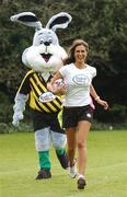 10 April 2007; Model Roberta Rowat is chased by the Irish Tag Rugby Association bunny at the launch of the Volvic Tag Rugby Summer Leagues. Herbert Park, Ballsbridge, Dublin. Photo by Sportsfile