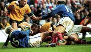 6 November 1999; Ben Tune, supported by Australia team-mate Jason Little goes over to score a try, despite the efforts of Xavier Garbajosa, 15, and Richard Dourthe of France during the Rugby World Cup Final match between Australia and France at the Millenium Stadium in Cardiff, Wales. Photo by Matt Browne/Sportsfile