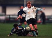 18 December 1999; Brendan Burke of Barnhall RFC in action against Mick Cassidy of Suttonians RFC during the AIB All-Ireland League Division 4 match between Barnhall RFC and Suttonians RFC at Barnhall RFC in Leixlip, Dublin. Photo by David Maher/Sportsfile