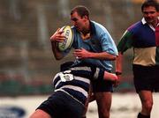 27 November 1999; Cal McLean of UCD RFC is tackled by Eric Delreux of Wanderers RFC during the AIB All-Ireland League Division 2 match between Wanderers RFC and UCD RFC at Lansdowne Road in Dublin. Photo by Damien Eagers/Sportsfile