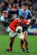 14 November 1999; Enda McNulty of Armagh in action against Colin Moran of Dublin during the Church & General National Football League match between Dublin and Armagh at Parnell Park in Dublin. Photo by Matt Browne/Sportsfile