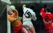 14 November 1999; Derry goalkeeper Eoin McCloskey in action against Mark Milham of Kildare during the Church & General National Football League match between Kildare and Derry at St Conleth's Park in Newbridge, Kildare. Photo by Damien Eagers/Sportsfile