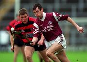 28 November 1999; Greg Baker of St. Joseph's Doora-Barefield in action against Niall O'Donnell of Ballygunner during the AIB Munster Senior Club Hurling Championship Final match between Ballygunner and St. Joseph's Doora-Barefield at Semple Stadium in Thurles, Tipperary. Photo by Ray McManus/Sportsfile