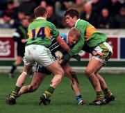 28 November 1999; Declan D'Arcy of Dublin is tackled by Liam Hassett, left, and Eamonn Fitzmaurice of Kerry during the Church & General National Football League match between Dublin and Kerry at Parnell Park in Dublin. Photo by David Maher/Sportsfile